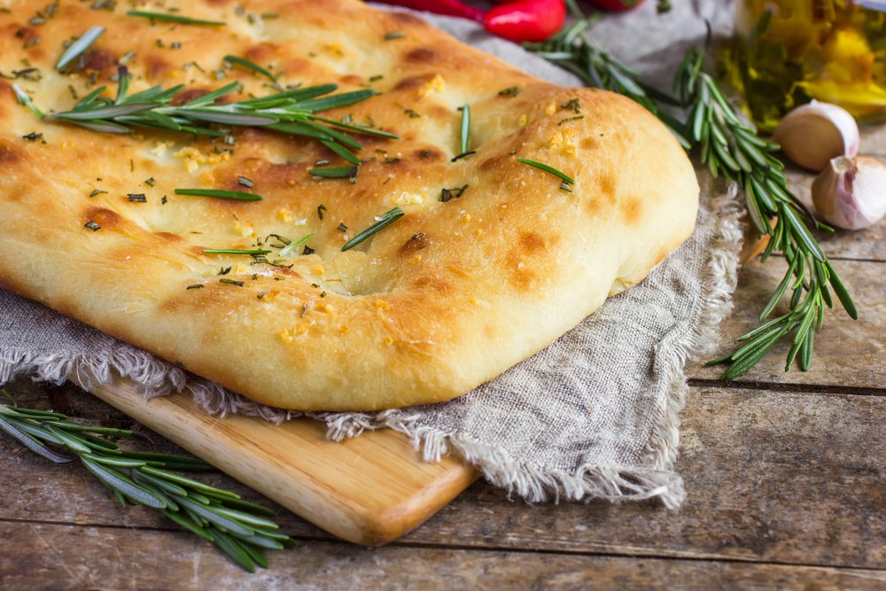 Italian,Focaccia,Bread,With,Rosemary,And,Garlic,On,A,Rustic