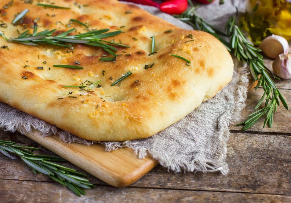 Italian,Focaccia,Bread,With,Rosemary,And,Garlic,On,A,Rustic