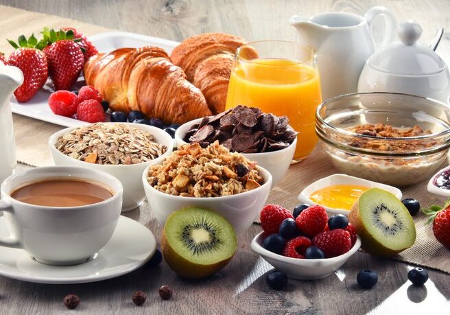 Breakfast,Served,With,Coffee,,Orange,Juice,,Croissants,,Cereals,And,Fruits.